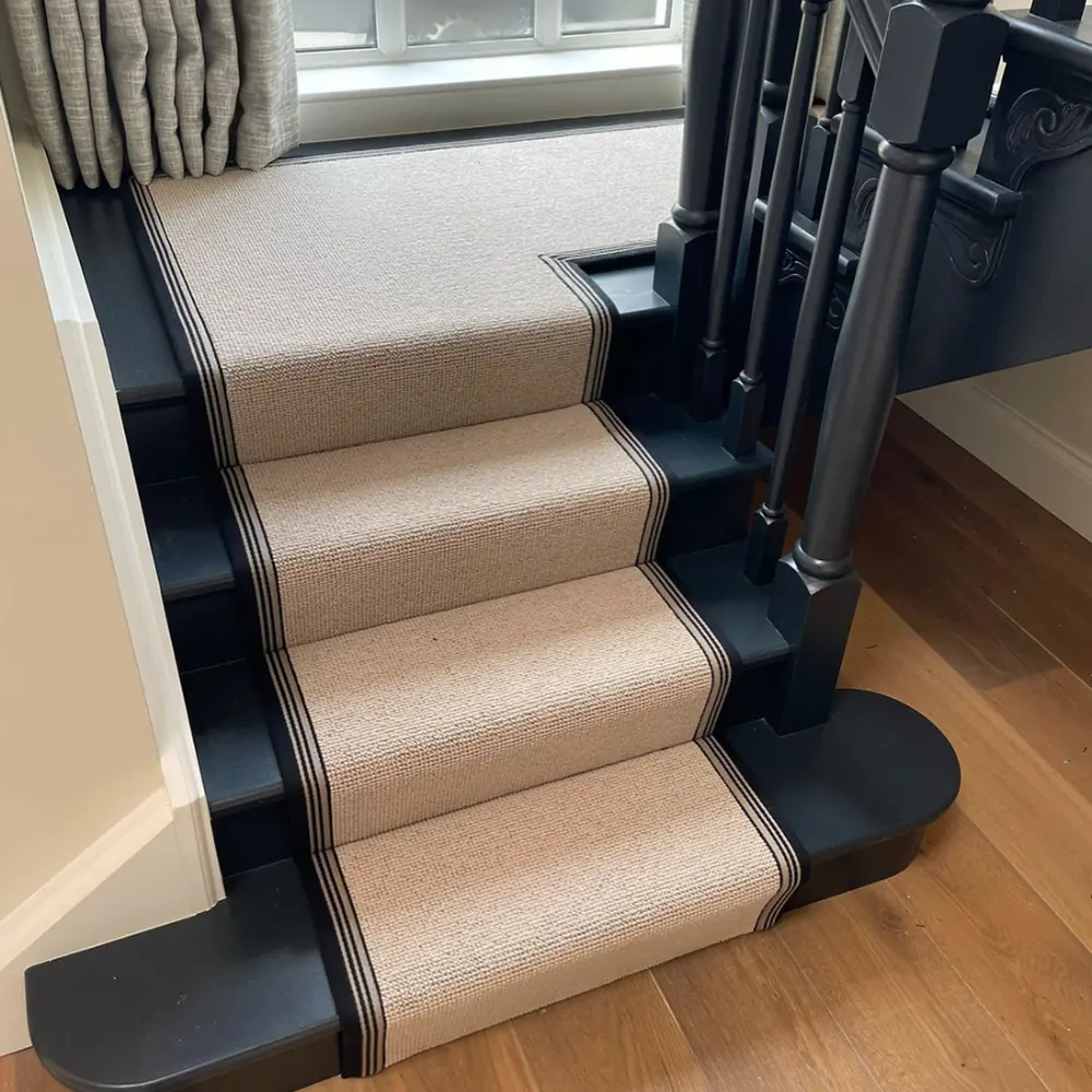 Custom border stair runner installation.