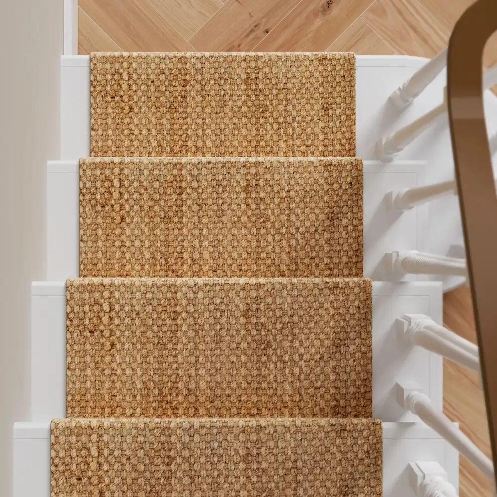 Textured jute runner on stairs.